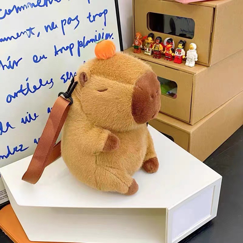 Venta directa de fábrica: bolsas de maquillaje de dibujos animados, muñecos de peluche, juguetes portátiles para niños, bolsos para mujer, muñecos de máquina de garras y otros productos.