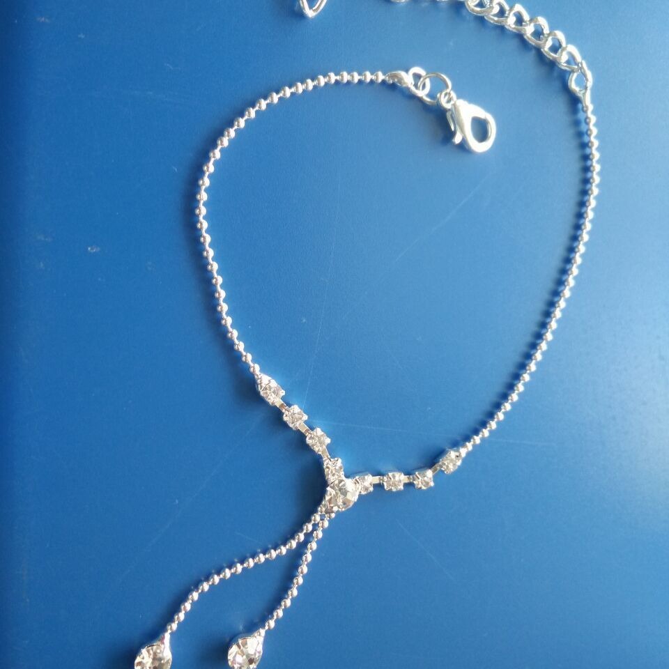 Catena corpo con nappe in strass a goccia per donna in argento_voghion.com