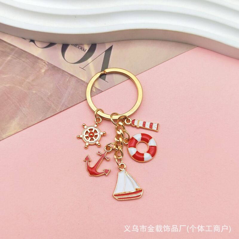 国境を越えた航海帆船のキーホルダーに油を垂らした金属灯台救命輪船舵文創プレゼントバッグストラップ飾り|undefined