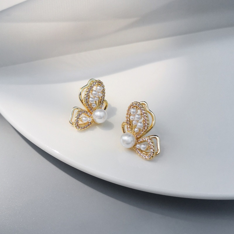 fashion hollow three-dimensional butterfly pearl earrings wholesale