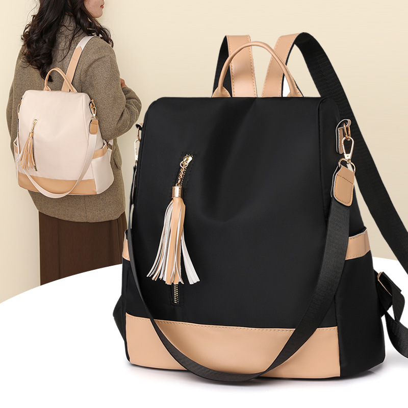 2024 nueva mochila de color de contraste moda simple mochila casual mujer cuero suave bolsa de viaje ligera de gran capacidad al por mayor