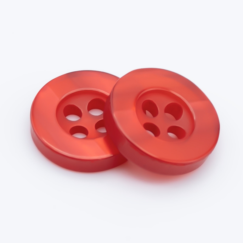 Venta al por mayor de color Botón de camisa de resina hebilla de cuatro ojos transparente blanco y negro Botón de pan teñido en stock botones