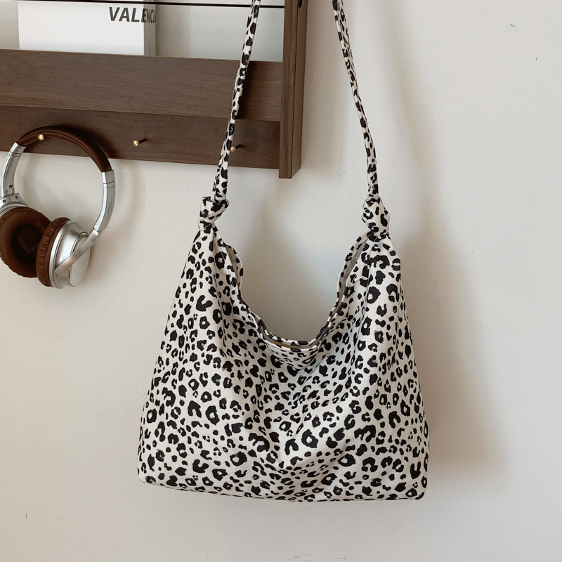 Estudiantes universitarios clase de viaje bolsa de gran capacidad para mujeres 2024 nueva moda extranjera leopardo tela mochila