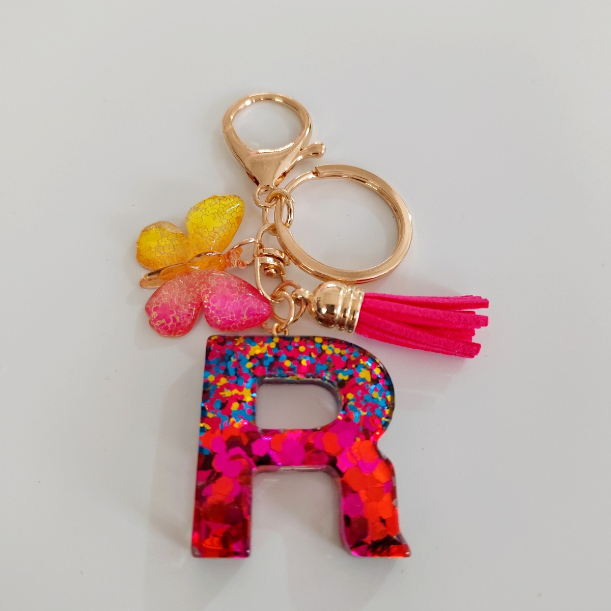 Ventas transfronterizas calientes de letras inglesas de color mixto colgante de llavero colgante de mariposa fringe de resina de llavero colgante de joyería
