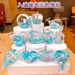 青い雪の花の色の玉のロリポップのアクリルの瓶の流砂の夜光の卸売りのアイデアのペンダントは油のミッキーの部品に入ります。