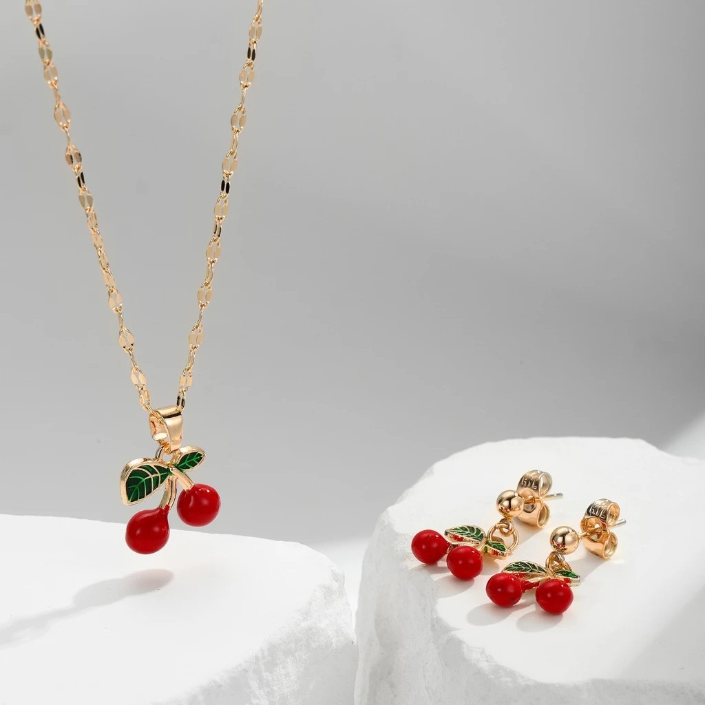 Explosiones transfronterizas coloridas cereza roja pintada a mano goteo de frutas series de joyería simple colgante de viento conjunto de aretes collar