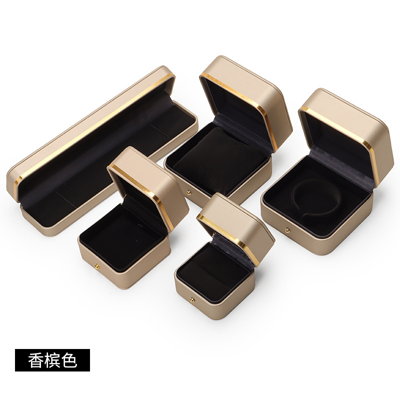 Caja de joyería de cuero de PU de borde dorado redondeado al por mayor caja de regalo de joyería de gama alta caja de reloj caja de joyería colgante de anillo