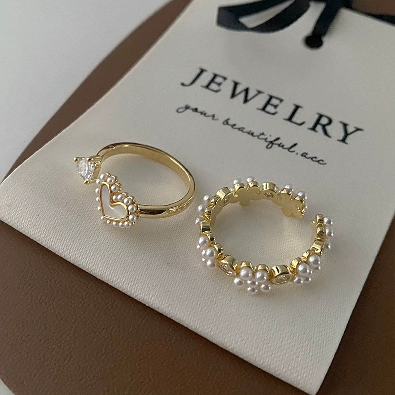 Small design retro universal ring from pearl, flowered, simple and elegant design, on index finger