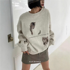 純綿の新型猫のプリントの丸首の服の女性の秋冬のoversize2025はゆったりしています。