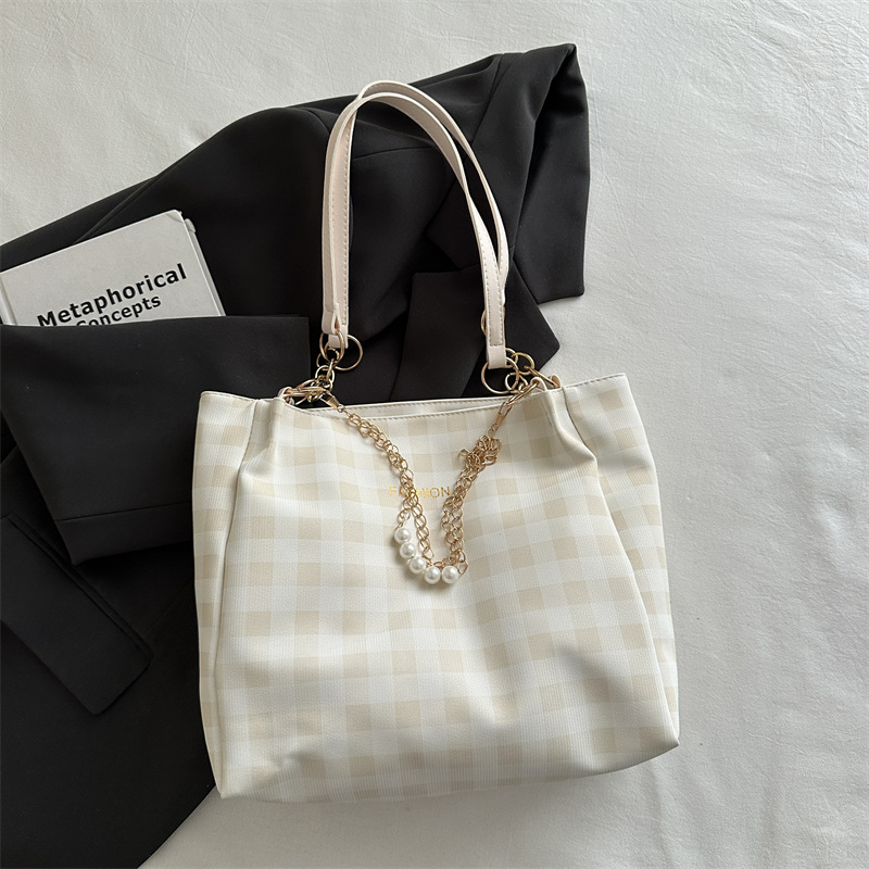 Bolsa de alto valor reticular para mujeres 2026 primavera y verano nuevo paquete de viaje de hombro universal bolso de nicho en línea bolsa de mujer