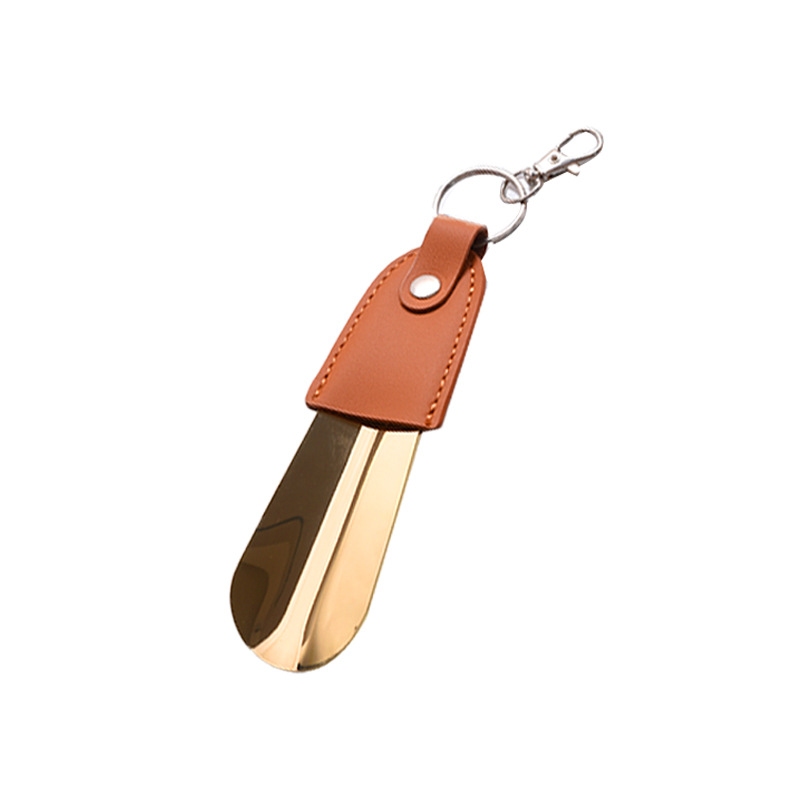 En stock suministro de acero inoxidable hebilla de llave tirador de zapatos con cubierta de cuero tirador de zapatos llave del coche colgante fácil de llevar levantador de zapatos