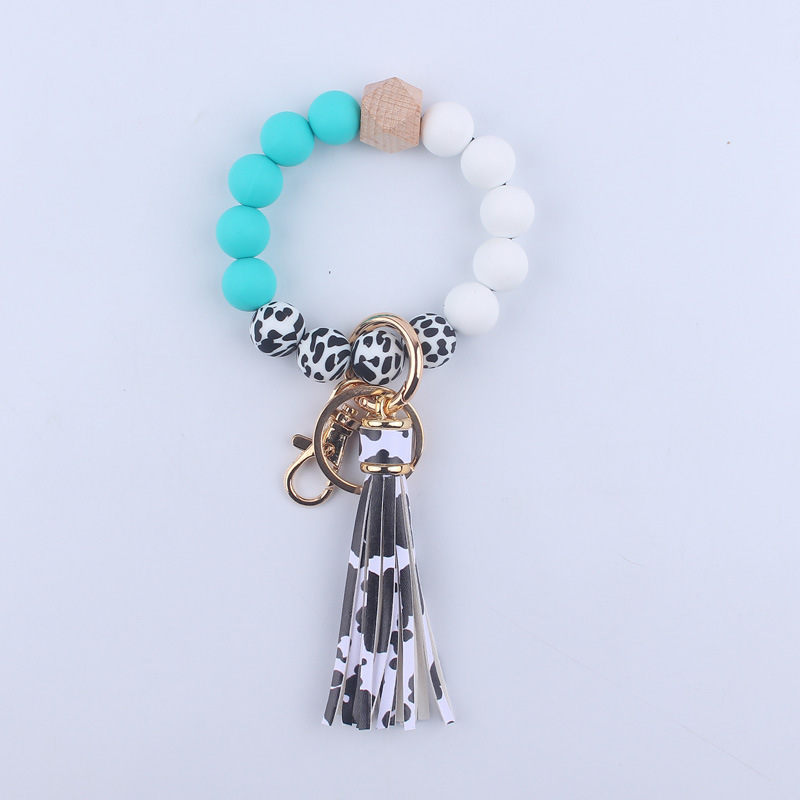 Nuevo cuero de LA PU corto Borla Llavero DIY de silicona de impresión de leopardo de color sólido con cuentas muñeca llavero colgante