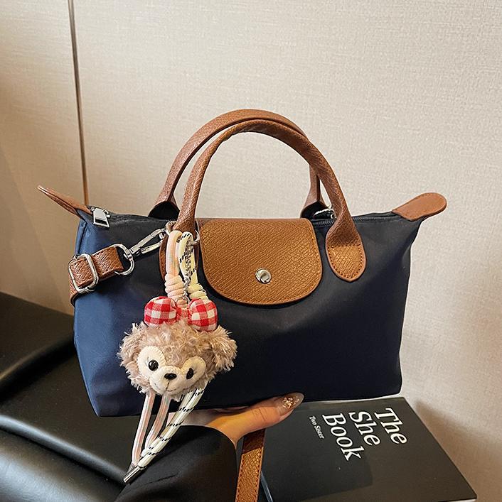 Bolsa de mano francesa de nicho Zhonglong para mujeres 2025 nuevo paquete de hombro casual universal para viajar bolso de alta calidad