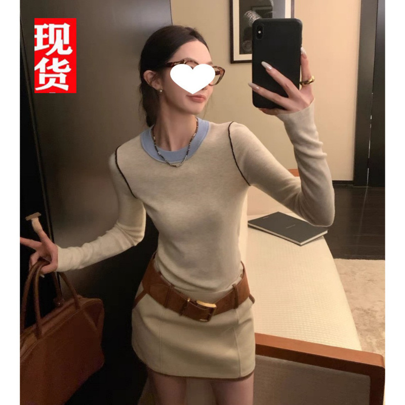 欧陽は色のニットの女性の冬の新型の丸首の中で底のシャツを掛けて身を修めるのがやせている長袖の上着を現します。|undefined