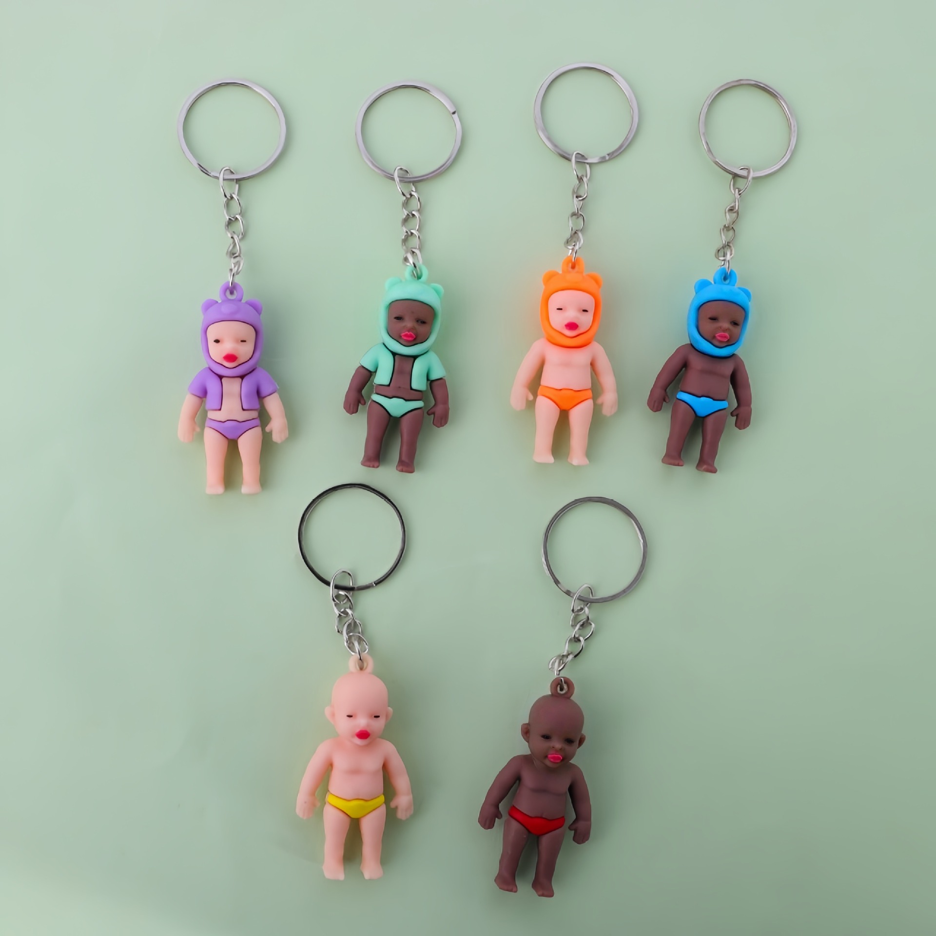 Bloqueo negro Baby decolor llavero colgante de automóvil decolor UV creativo accesorios de muñeca al por mayor