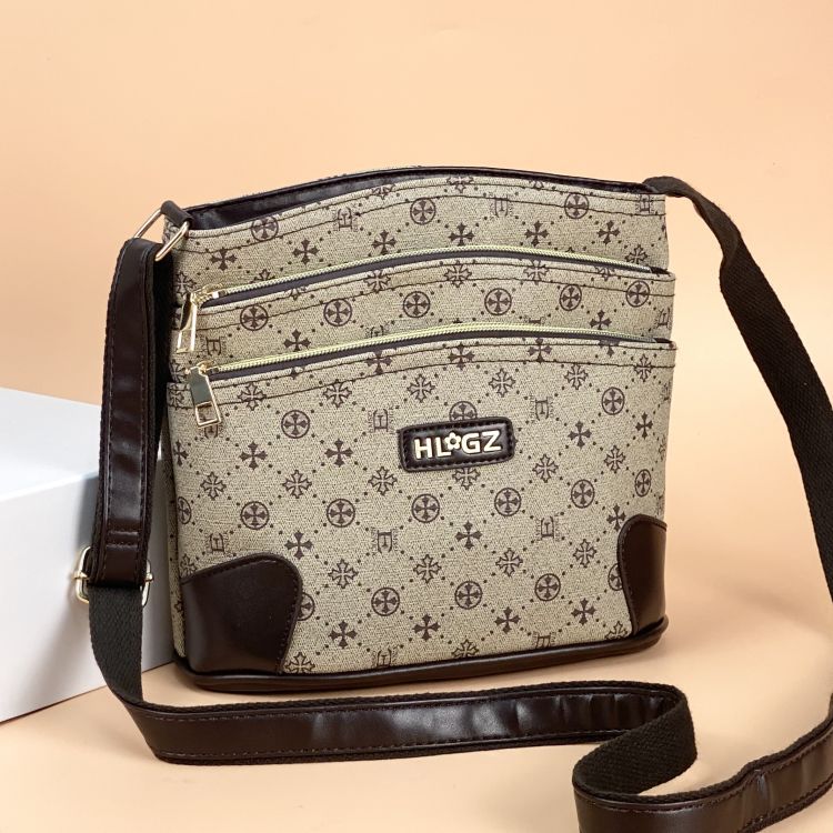 Guangzhou Hengli equipaje para mujer 2025 nuevo estilo coreano bolso de mensajero de un solo hombro bolso de cubo madre de mediana edad bolso de varias capas mujer