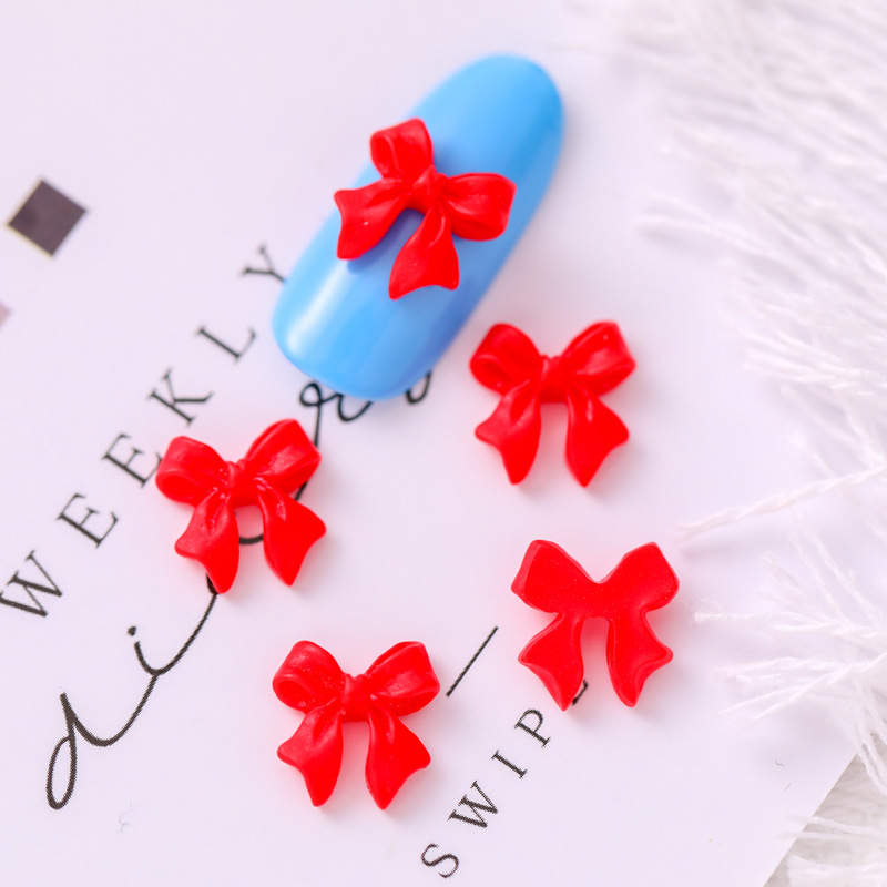 Mariposa de uñas popular repujado arco resina pajarita joyería simple todo partido tridimensional hueco decorativo diamante