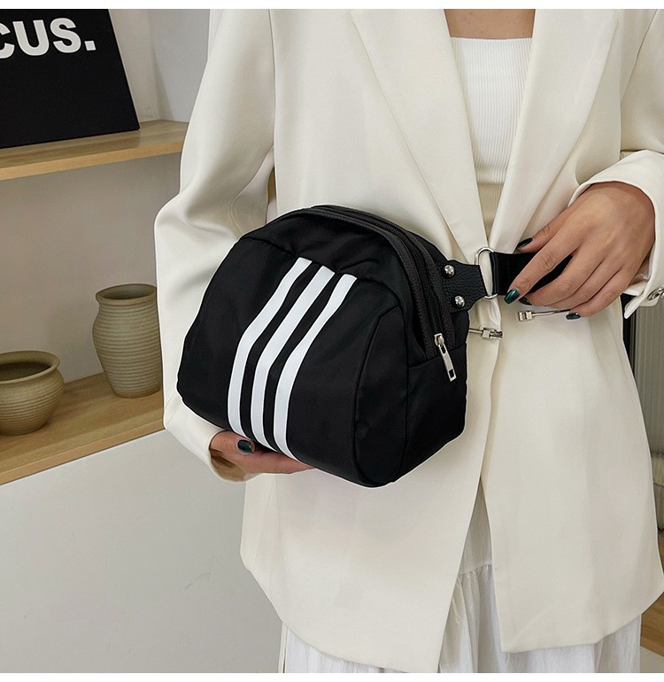 The 2024 new stylish and simple crossbody bag, a large-capacity versatile single-shoulder bag, is popular among students. The three-bar chest bag is selling well undefined