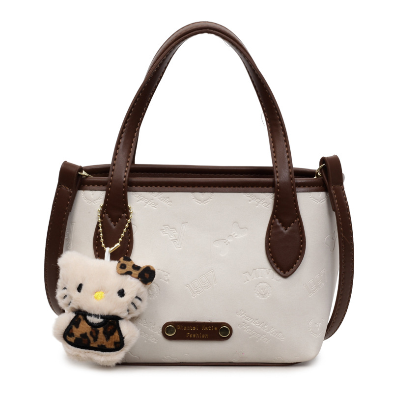 Corea del Sur super caliente retro bolso de mano de estilo extranjero para mujeres 2025 nueva moda simple hombro mochila bolso de cubo de moda