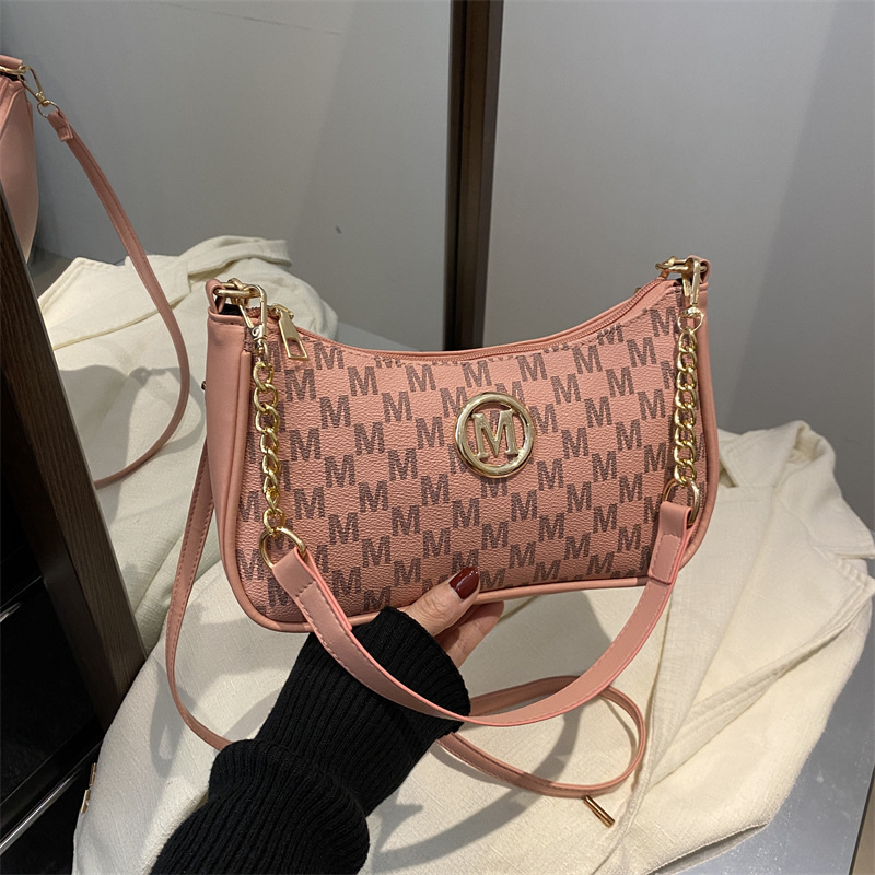 Este año, la moda de 2025, la nueva bolsa de nicho, la bolsa de hombro personalizada de estilo extranjero, la impresión de letras, la bolsa inclinada, la bolsa de media luna