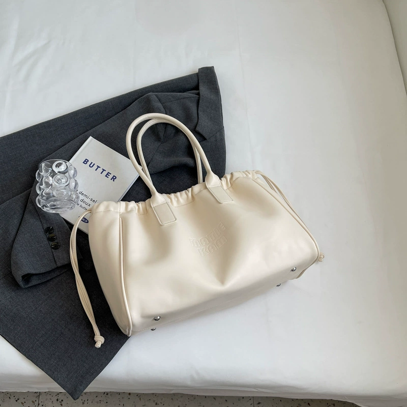 Universal small design shoulder bag, capacious one-shoulder bag, 2023 collection, genuine leather, drawstring