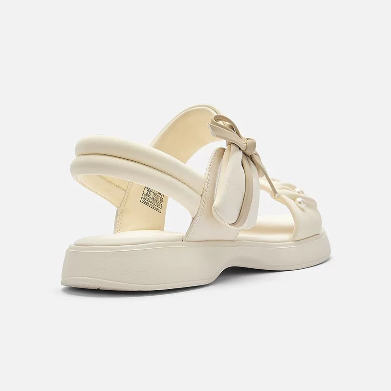 Zapatos de playa de moda de niñas versátiles 2026 verano nuevos zapatos de arco para niños Lefour zapatos de princesa huecos