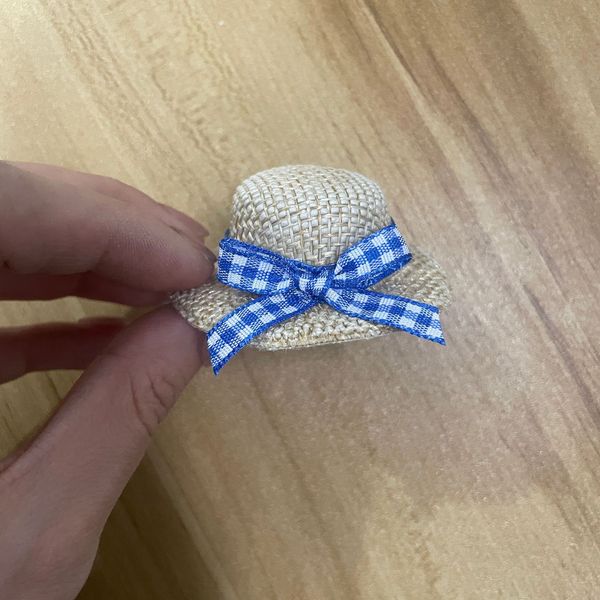 small woven plush toy with bow