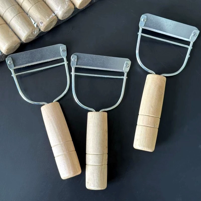 Выскабливание фруктов и овощей Овощечистка деревянная ручка строгание фруктов строгание нержавеющей стали Овощечистка один юань два юаня универмаг