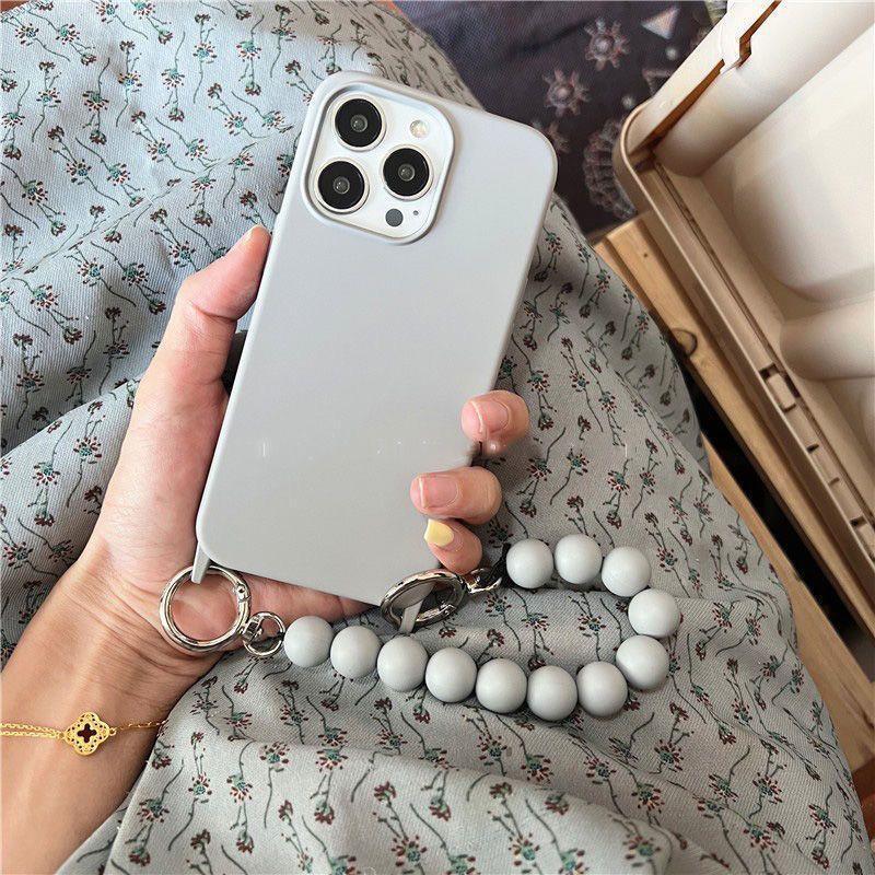 Cáscara de teléfono móvil iphone15 diagonal portátil de color sólido 16ProMax simple y elegante para Apple 14 nueva mujer 13