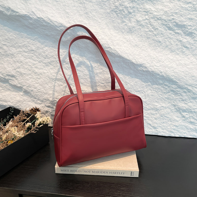 Bolso de hombro coreano de gran capacidad para mujeres 2025 primavera nuevo bolso de brazo retro estilo extranjero bolso de viento minimalista