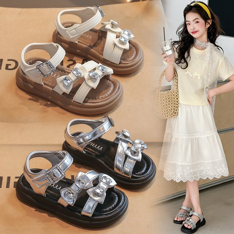 Zapatos de princesa para niñas 2025 verano nuevo estilo romano para niños con suela suave sandalias de moda de diamante