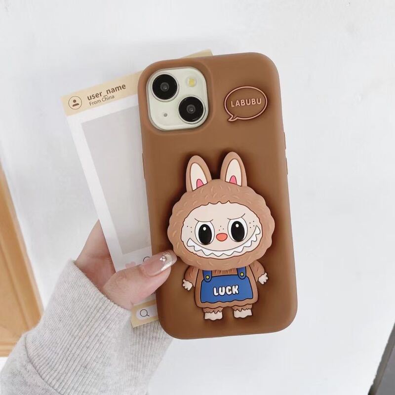 漫画風のかわいいラブブ付きスタンド付きスマホケース、Apple iPhone16/15/13/14対応、シリコン製、滑り止め|undefined
