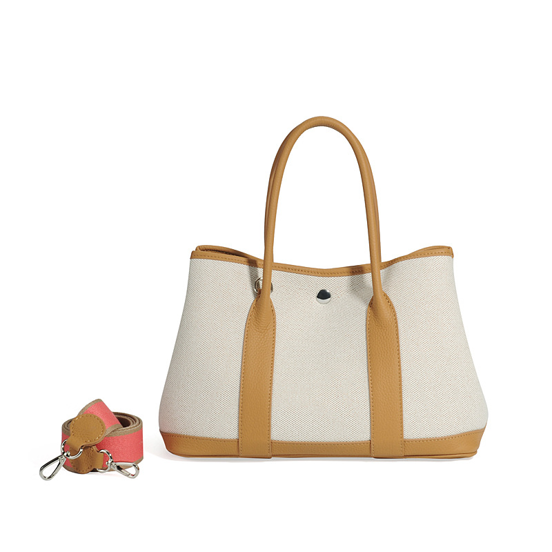 大容量ガーデンバッグキャンバスは色にぶつかった本革のトップ層牛革をつなぎ合わせて、シングル肩のショッピングバッグを持っています。