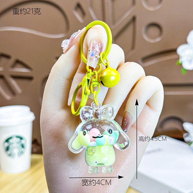 Caricatura creativa adorable acrílico frijoles de azúcar fluir arena jade Gui perro llavero colgante adornos puestos de productos al por mayor