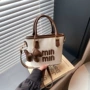 minmin新款斜挎字母水桶包