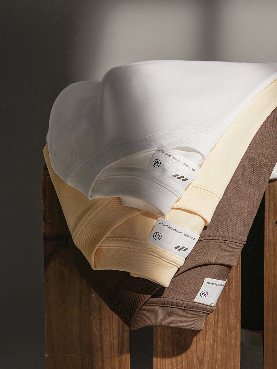 Nuevos productos de verano 260g camiseta de algodón pesado marca de moda calle suelta blanca de manga corta camisa de fondo de color sólido para hombre al por mayor