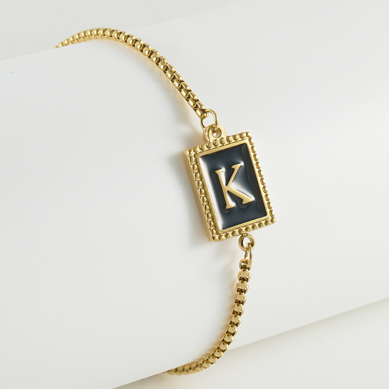 La moda europea y americana transfronteriza del acero inoxidable 26 pulsera inglesa de la letra en relieve pulsera Titanium de la cremallera del acero 18K de la frontera para las mujeres