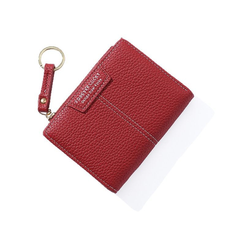 Cartera corta de mujer de color sólido de lujo ligero nicho Volkswagen gran capacidad dos carteras plegables cremallera mini bolso de cambio de mujer