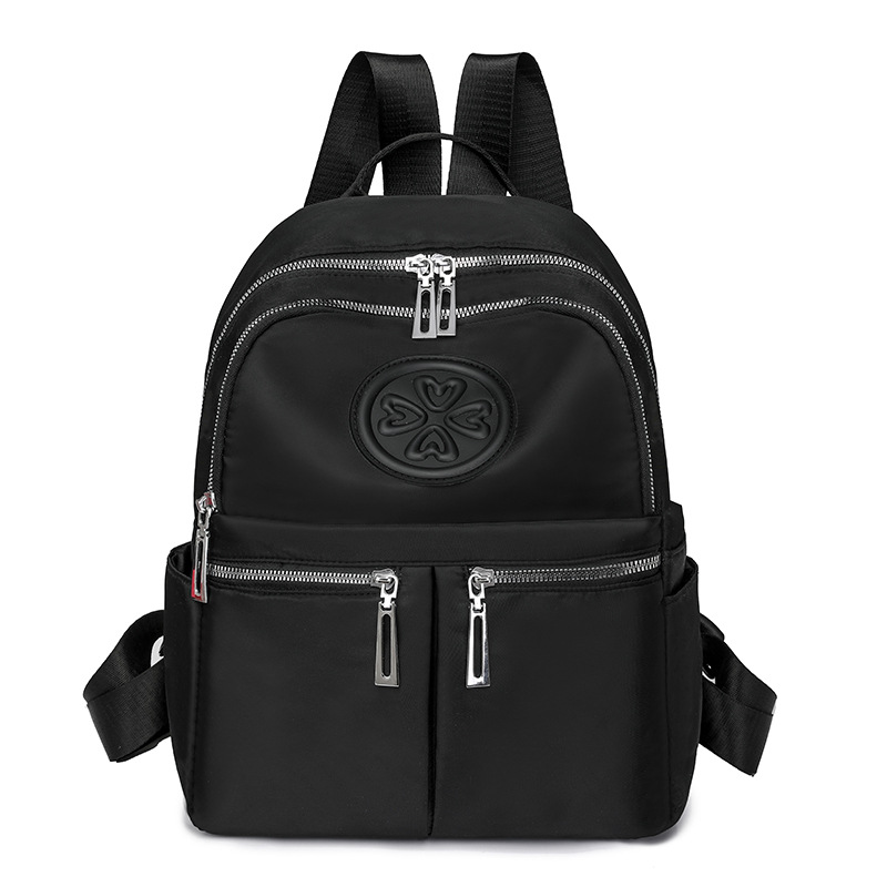 2025 nueva mochila de nailon casual para mujer, mochila de viaje al aire libre de gran capacidad en relieve de moda, mochila escolar para estudiantes