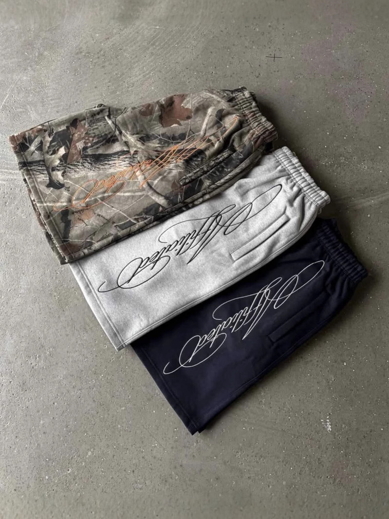 American Retro Europa y Estados Unidos Calle transfronteriza hip-hop verano bordado pantalones cortos sueltos casuales de moda pantalones cortos hombres