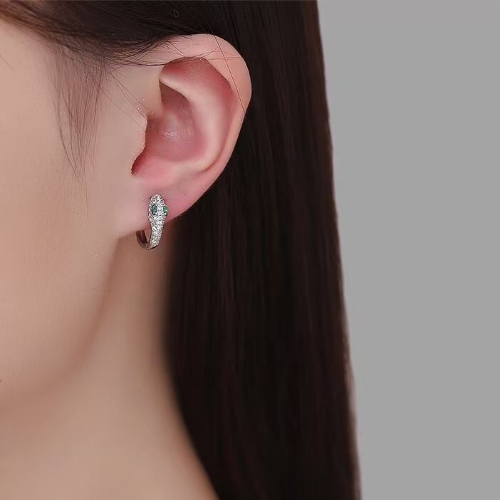 El diseño de nicho de los auriculares en forma de serpiente europeas y estadounidenses transfronterizos es único, lujoso y exquisito, auriculares de moda universal.