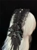 6. Black spiked feather headband