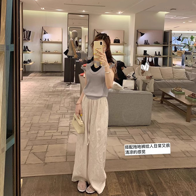 Grava Madre verano nuevo estilo de moda de pan de red hueco con playa de mitad zapatillas de fondo plano para mujeres de verano