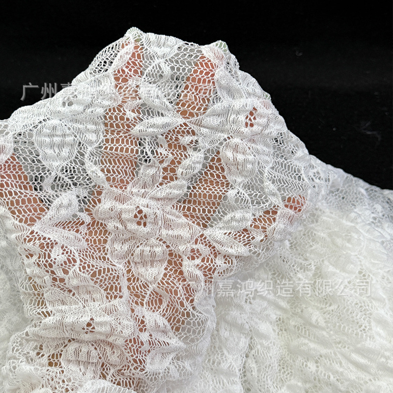 Tejido de encaje de burbuja plegado tela de encaje tridimensional base de encaje elástico fabricantes de ropa de mujer en stock