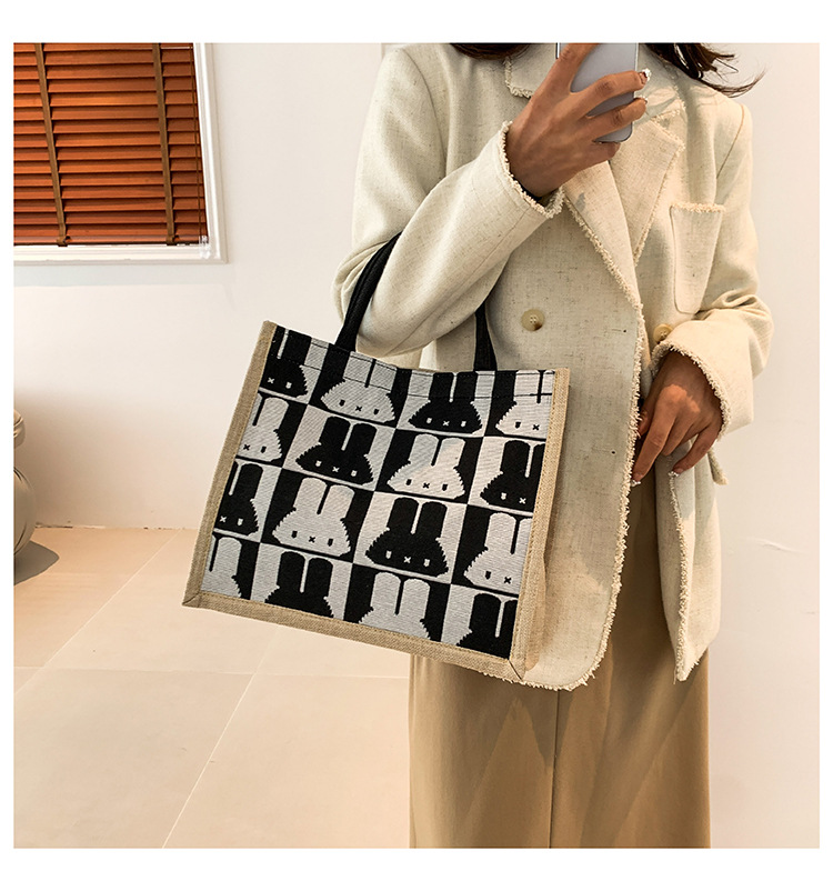 High-end mid-capacity canvas school commuting handbag 2024 new style fashionable and versatile linen single-shoulder tote bag details Picture