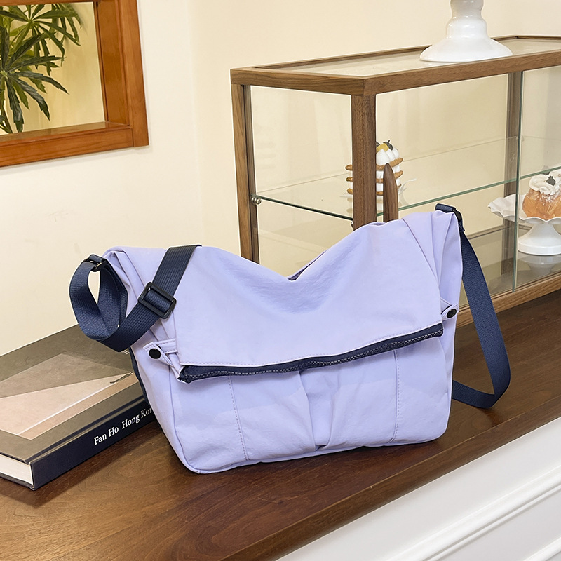 Bolso de lona de moda coreana 2025 verano nuevo bolso femenino estilo universitario bolso de hombro casual bolso de mensajero de gran capacidad marea