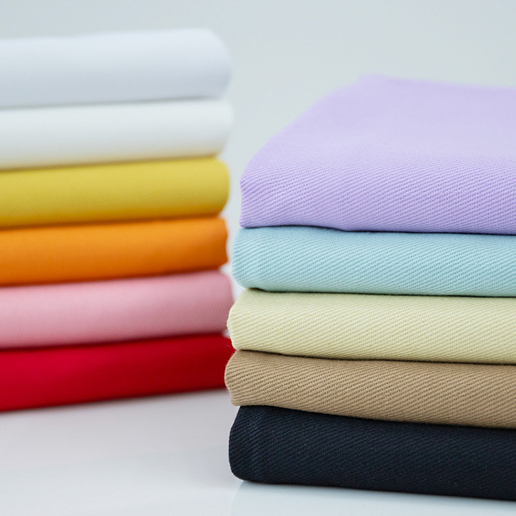 Color 10 * 10s 260gsm teñido de tejido de algodón grueso de hombre de algodón de tela de twill pantalones