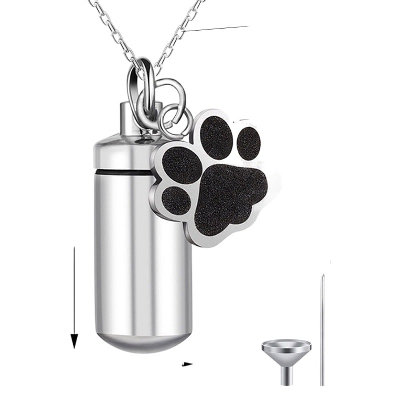 AliExpress venta caliente de acero de titanio memorial parientes mascota cinerario ataúd colgante puede abrir cilíndrica sello de pata botella de perfume collar