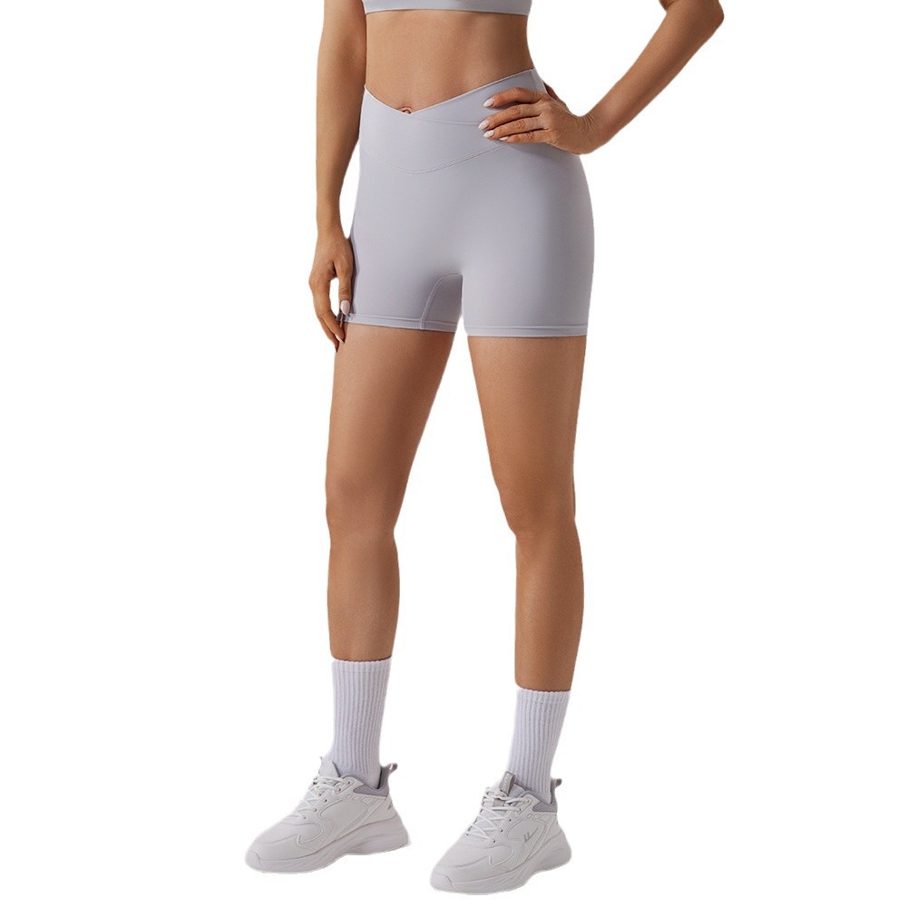 Procesamiento personalizado europeo y americano elástico mel桃 hips fitness pantalones cortos desnudos secado rápido sexy para elevar las hips de yoga de mujer panty