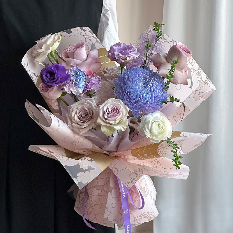 Fábrica al por mayor tienda de flores personalizada material de embalaje floral película de extinción impermeable historia de jardín embalaje de flores papel ligero